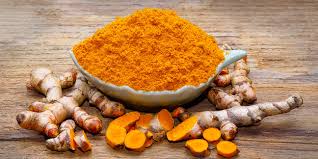 Turmeric root and powder, widely used in Ayurvedic remedies.